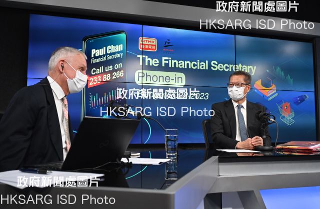 The Financial Secretary, Mr Paul Chan (right), attends Radio Television Hong Kong Radio 3's programme "Financial Secretary Phone-in" this morning (February 25) to answer questions from the public on the 2022-23 Budget.